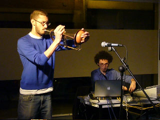 Scene of trumpets with a laptop in a room